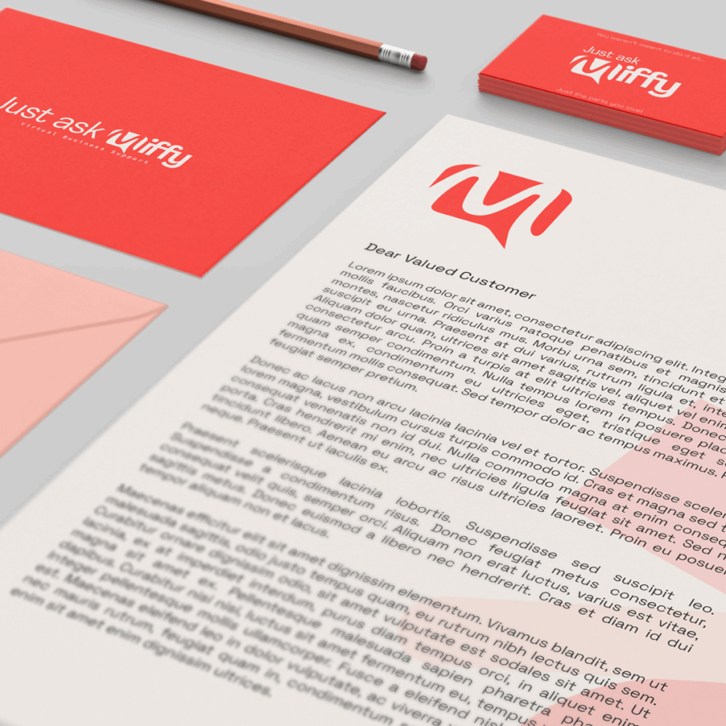 A headed sheet of paper, business card, envelope and pencil