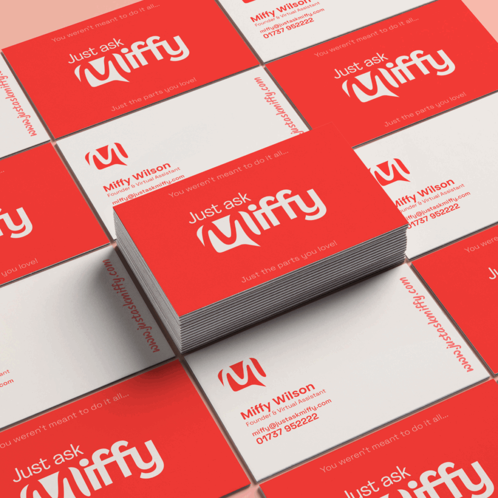 Stacks of red and white Just ask Miffy business cards